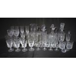 A quantity of cut crystal glassware, including various decanters, tumblers and glasses, some Royal