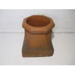 A terracotta chimney pot.