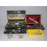 A quantity of silver plated cutlery, contained within two canteens, some loose.
