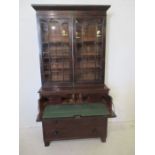 A Victorian Irish mahogany flamed escritoire bookcase