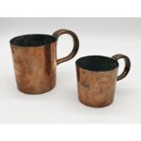 Two copper navy rum or grog measures, with loop handles, comprising of a quart and pint with