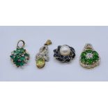 Four 9ct gold pendants set with gemstones including tourmaline, sapphires, peridot etc.total