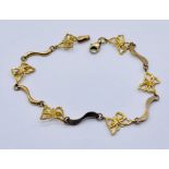 A 9ct gold bracelet, links in the form of butterflies, weight 3.3g