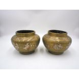 A pair of Eastern brass pots, inlaid with silver and copper.
