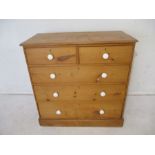 A Heal & Sons pine chest of drawers, top A/F, length 106cm, height 103cm.