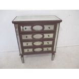 A mirrored chest of four drawers, length 101cm, height 82cm.