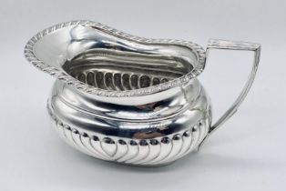 A silver cream jug, Birmingham 1911, weight 190.6g