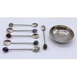 A small hallmarked silver dish along with a set of gem set coffee spoons