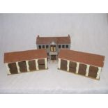 A set of three handmade farm buildings including a house and two sets of stables