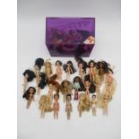 A collection of twenty two Lil Bratz dolls (17 females, 5 males), along with a collection of various
