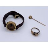 A 9ct gold stick pin set with a seed pearl, scrap 9ct ring and a ladies 9ct gold watch ( A/F)-