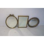 Three gilt framed wall mirrors.