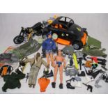 Three vintage Action Man figures, along with selection of accessories including vehicles, weapons,