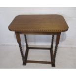 An oak occasional table on barley twist legs, length 61cm, height 66cm.