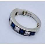 A good platinum half eternity ring set with diamonds and sapphires- each stone measuring