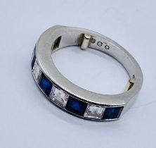 A good platinum half eternity ring set with diamonds and sapphires- each stone measuring