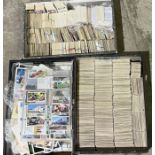 A large collection of cigarette cards over three boxes including Wills, Players, Gallaher etc.