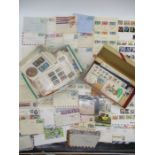 A collection of loose leaf worldwide stamps, envelopes, first day covers and postcards including a