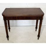 A Victorian mahogany tea table with fold over swivel top