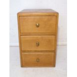 A 20th century oak three drawer cabinet.