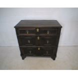 A Jacobean oak chest of three drawers, with replacement feet, length 84cm, height 85cm.