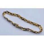 A 9ct gold bracelet set with diamonds, total weight 9.7g