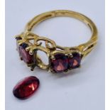 A 9ct gold garnet five stone ring- 1 stone loose but present