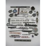 A collection of vintage car badges including Ford, Volvo, RAC, Allegro, Vauxhall, Cortina etc