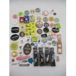 A collection of various vintage badges, along with Guinness Miniature Bottles, beer openers, beer
