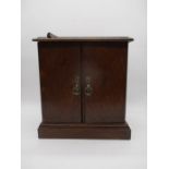 An oak table top collectors cabinet - one piece of edge off but present
