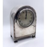 A silver plated dome topped mantle clock