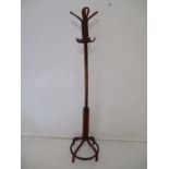 A wooden coat stand.