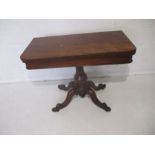 An early Victorian mahogany fold over card table - one leg loose