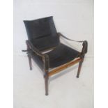 A "By Land & By Sea" campaign design desk chair with black leather upholstery on turned supports