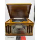 A Crosley vintage styled record, tape and CD player.