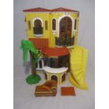 A Bratz Passion 4 Fashion Spanish Mansion dolls house with accessories including palm trees,