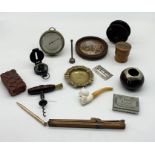 An assortment of items including Swiss made desk barometer, pot lid, engineer's compass, fishing