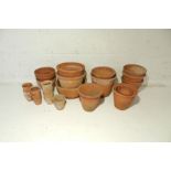 A quantity of terracotta garden pots.