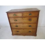 A Victorian pitch pine chest of five drawers, with brass handles, length 107cm, height 104cm.