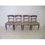 A set of four antique mahogany upholstered dining chairs.