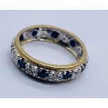 A 9ct gold eternity ring set with sapphires and diamonds