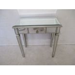 A mirrored side table, with single drawer, length 78cm, height 89cm.