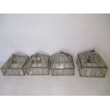 A set of four Victorian cast iron cloches with detachable cover and square base - glass A/F