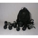 Two Panasonic DMC-FZ30 digital cameras, along with a Canon EOS 350D digital camera, an assortment of