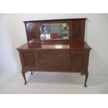 An Edwardian sideboard with mirrored back.