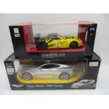 A boxed Rastar Aston Martin DBS Coupe radio controlled car (1:14 scale, along with a boxed M&S