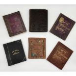 A collection of full and part full albums of crests and monograms along with two unused 19th century