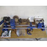 A Record wood-turning lathe (serial number 035217) with a selection of accessories including a