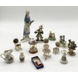 A collection of various ceramics including miniature Limoges furniture pieces, a Goldscheider with