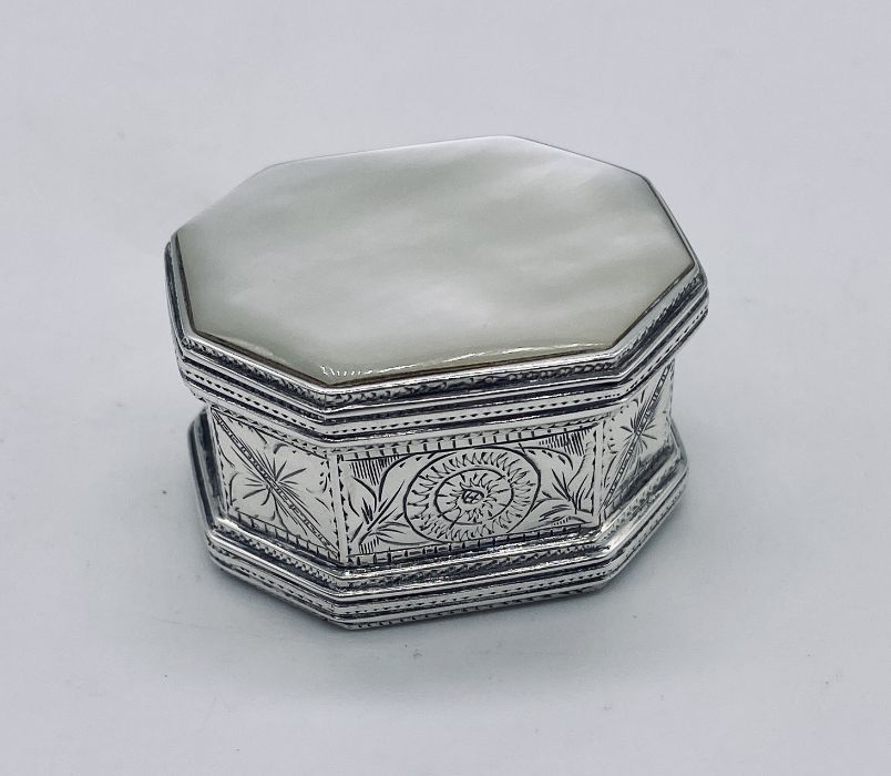 A 925 silver pill box with mother of pearl inset to lid